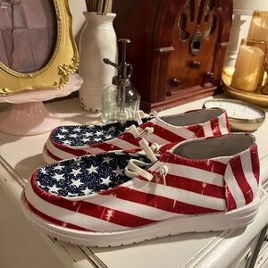 Red and White Athletic Slip-On Shoes with Patriotic Design